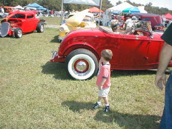 Even little guys love to see pretty Blondes driving a '32 Highboy Roadster.