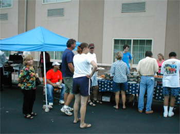 Our fearless leader, Mary Ann in the food line at the Laquinta party