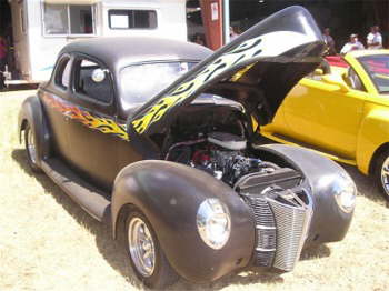 Dennis Roccato has a good time in his primered '40 Ford