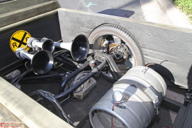 Rollin’ on 22” & 24” wheels is only the beginning of a long list of features on Mike Gomes’ 454 Chevy powered ’56 Chevy Pickup from Cerritos, CA.  The bed is missing, the gas tank is a beer keg, the license plate interior, and a unique hood latch.