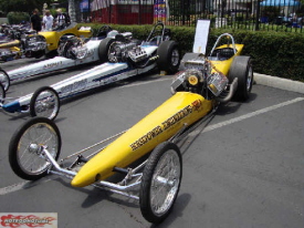 Nostalgia Top Fuel Dragsters lined up in front of the NHRA Museum.