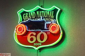 The Garage is a jewel with colorful neon signs around the walls, posters and signs hanging from the ceiling and lots of gas station memorabilia.