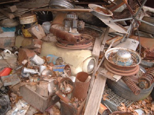 A Lost 57 - Thought others might find this picture interesting.  This was just as I found it in an old barn in north central Arkansas.  Just in case some don't recognize it thats the right front fender of a 57 Ford under 30 or so years of accumulation. I