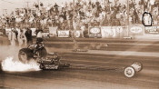 I think we've all seen the classic photo above of Don Garlits' career-changing transmission explosion at Lions, I'm not sure who circled the fan in the stands or why, but that's how this image was posted.