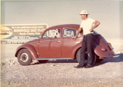 The worlds first VW record holder beside the billboard welcoming folks to the famed Bonneville Salt Flats in 