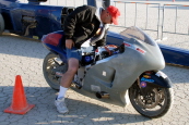 The fastest vehicle down the track was the Noonan-Derwin-Moreland 1650 cc Class APS/BG motorcycle with John Noonan aboard. He slip slided himself down the track at 242.106 mph.  John is seen Sunday morning as he brought the ride to the starting line.  Pho