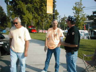 Brothers Dave and Don Lewallen listening to Jack tell a tall tale