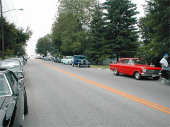 Lined up on both sides of the street waiting to get into town