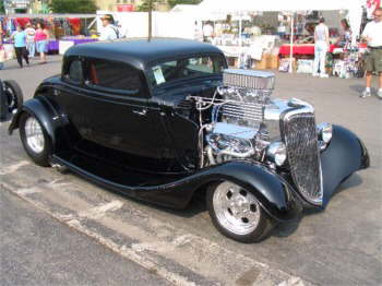 Marge and Ed with their Outragious Black Ford Coupe