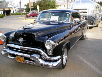 Dick Thomas and his wife showed off their '53 Olds with attached Airstream trailer