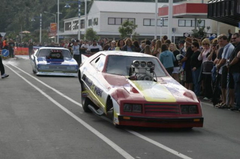 Funny Car and Pro Mod cars being DRIVEN in the Parade