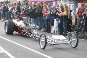 Pins driving their SBC dragster in the parade