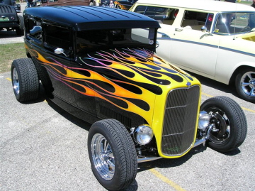 44 Karl Cole  has a flaiming '31 Ford Sedan