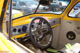 This hoodless, yellow, Chevy powered, 40 Chevy Coupe stands out in a crowd. The owner is Patrick Bradley of Rancho Cucamonga, CA.