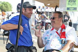 Photographer Mark Gewertz shares a laugh with NHRA Museum Curator Greg Sharp.