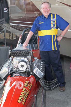 Always popular TV Tommy Ivo posses by his restored Top Fuel Dragster.