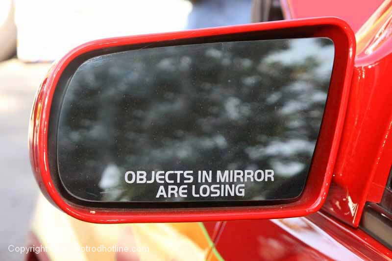 This is what a real racers rearview mirror should say!