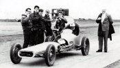 Again, it's the people who make this shot. The clown, second from left, doing his "Take the picture already" pose and the other guy still slipping on (or off?) his coat, who's clearly not ready for the shot. And that dragster? Not much traction in those r