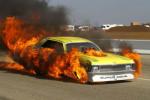 Walls exit the car w/only minor burns from the intense flames, but the car burne