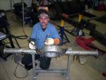 Owner Tom Hurd, tig welding 4-link brackets on a 9” ford rearend going under a 5