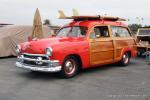 – This classic ’51 Ford Woodie is sporting some classic  	surfboards and some classic decals. The owner is Roger Roundy of Tustin, CA.